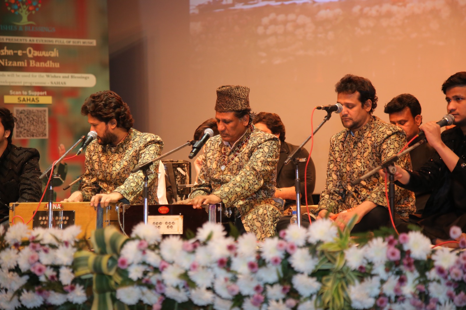 Artisans from the Jashn-e-qawwali musical event performing on the stage